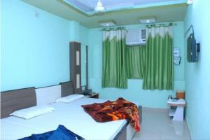 Posteľ alebo postele v izbe v ubytovaní Hotel Mittal Paradise