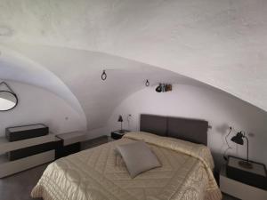 Säng eller sängar i ett rum på Petralava Etna B&B