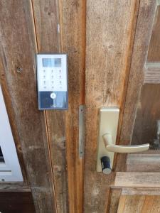 a wooden door with a box on it at Ferienanlage "Am Sidowsee" in Himmelpfort