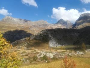 a view of a mountain range with mountains in the background at Hotel Adler in Foppolo