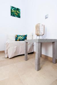 a table in front of a bed with a couch at Haraki Villas in Haraki