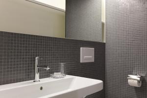 Vannituba majutusasutuses Hotel Dom - das Hotel mit dem Integrationskonzept