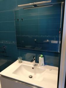 a bathroom with a sink and a mirror at Appartamento Valeria e Andrea in Porto Santo Stefano +25 photos