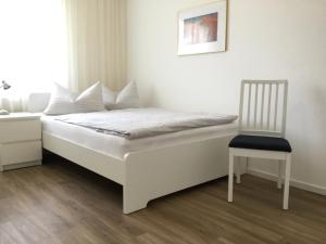 Säng eller sängar i ett rum på Ferienhaus Am Yachthafen
