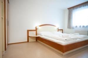 Łóżko lub łóżka w pokoju w obiekcie Seilergasse Apartments by we rent, SUMMERCARD INCLUDED