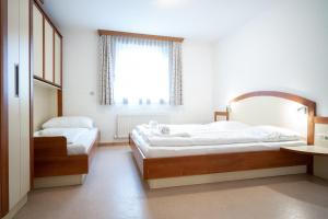 Posteľ alebo postele v izbe v ubytovaní Seilergasse Apartments by we rent, SUMMERCARD INCLUDED