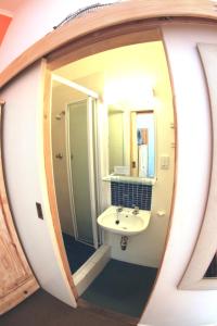 a bathroom with a sink and a mirror at House on the Hill in Cape Town