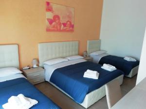 Postel nebo postele na pokoji v ubytování b&b MareSalento + 138 fotografií