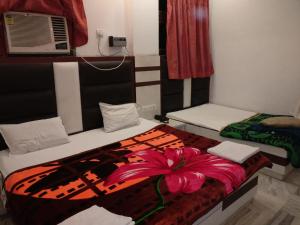 Postel nebo postele na pokoji v ubytování Hotel Marwari