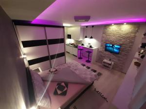 an overhead view of a bedroom with purple lighting at Victoria in Vračar (historical)