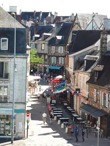 a city street with people walking down the street at Saint Bonnet in Bourges
