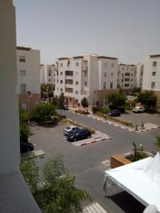 a view of a parking lot in a city at Appartement meublé sécurisé in Agadir