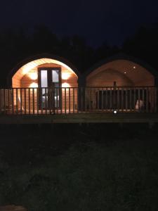 a domed house with a person in it at night at Tigh Beag na h'aibhne in Broadford