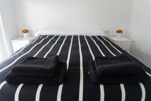 Ліжко або ліжка в номері Precioso apartamento en la playa Barcelona