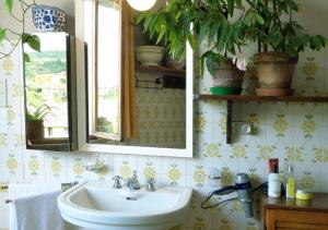 a bathroom with a sink and a mirror at La Finestra sul Fiume in Fossombrone +92 photos