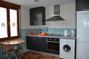 Kuchyň nebo kuchyňský kout v ubytování Casa Rural Casa Jacinta