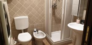 a small bathroom with a toilet and a sink at Casa vacanza croce di città CIR 0071 in Aosta