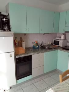 Kuchyň nebo kuchyňský kout v ubytování APARTMANI SENKA - VILLA OLIVER