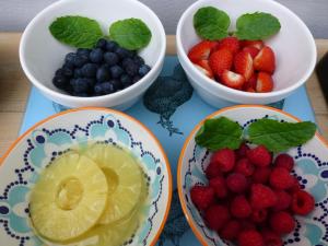 three bowls of fruit on a table with bowls of berries at Treveighan Farmhouse in Saint Teath +38 photos