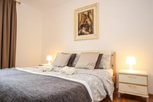Postel nebo postele na pokoji v ubytování Apartment Gala with balcony and private parking