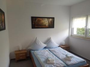 Ένα ή περισσότερα κρεβάτια σε δωμάτιο στο Ferienhaus zum Imker +25 φωτογραφίες