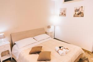 Cama ou camas em um quarto em Ruggero D'Altavilla Appartamento turistico