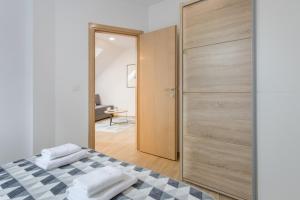 Posteľ alebo postele v izbe v ubytovaní Apartmani Mursa