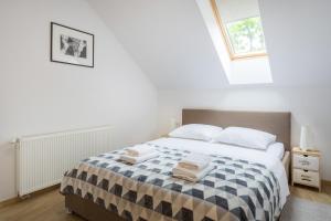 Posteľ alebo postele v izbe v ubytovaní Apartmani Mursa