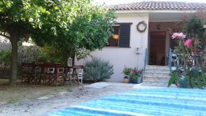 a house with a swimming pool in front of it at Villa Physis in Parga