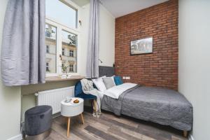 Posteľ alebo postele v izbe v ubytovaní Liv Apartments Old Town