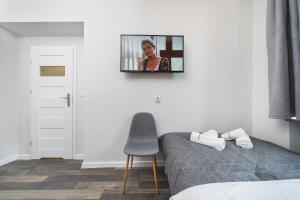 Televízia a/alebo spoločenská miestnosť v ubytovaní Liv Apartments Old Town