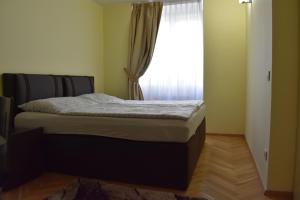 Posteľ alebo postele v izbe v ubytovaní Apartment Vikroria - Hálkova 5