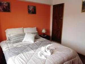 Postel nebo postele na pokoji v ubytování Kaboka Cusco Hospedaje Familiar