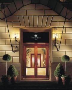 a front door of a building with a sign on it at Hotel dei Mellini in Rome