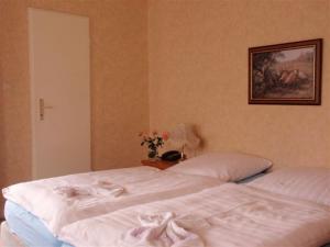 Postel nebo postele na pokoji v ubytování Hotel Richthofen