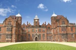 a large brick building with a clock tower on it at Birmingham Ruby, 2 bedroom Apartment in Birmingham