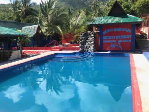 The swimming pool at or close to Napo Beach Resort