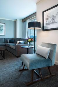 a living room with a couch and a chair at Hyatt Regency Denver at Colorado Convention Center in Denver