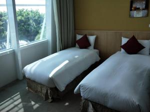 Postel nebo postele na pokoji v ubytování In Young Hotel