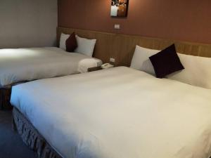 Postel nebo postele na pokoji v ubytování In Young Hotel