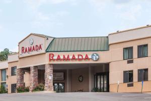 a building with a raminania sign in front of it at Ramada by Wyndham Newburgh/West Point in Newburgh