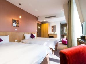 Postel nebo postele na pokoji v ubytování In Young Hotel