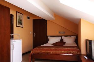Postel nebo postele na pokoji v ubytování Asti Arthotel