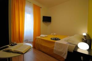 Televízia a/alebo spoločenská miestnosť v ubytovaní AD Trastevere Guest House - by AD Roma