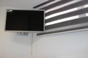 TV a/nebo společenská místnost v ubytování Apartamento con vistas al mar