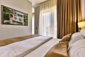 Postel nebo postele na pokoji v ubytování Hotel Lusso Mare by Aycon