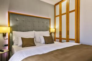 Postel nebo postele na pokoji v ubytování Hotel Lusso Mare by Aycon