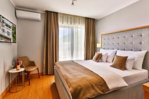 Postel nebo postele na pokoji v ubytování Hotel Lusso Mare by Aycon