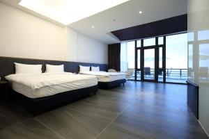 Uma cama ou camas num quarto em Hai Lan Homestay