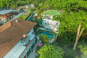 an aerial view of a house with a swimming pool at Baan Suan Villa 1 in Patong Beach